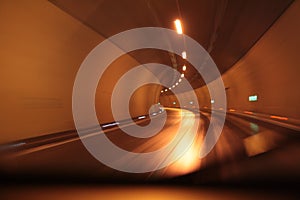 Highway tunnel at night . Motion blur