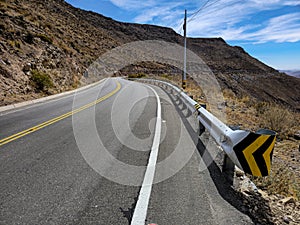 Highway view with galvanized steel guardrails with spiral-shaped ends