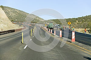 Highway workers work on state highway on Mescalero Apache Indian Reservation near Ruidoso and Alto, New Mexico