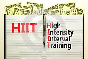 HIIT high-intensity interval training symbol. Concept words HIIT high-intensity interval training on book on a beautiful white