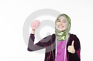 Hijab woman and dumbells for promoting a healthy fitness and lifestyle concept