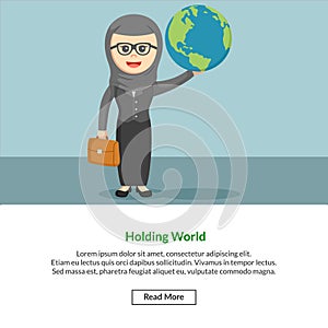 Hijabi enterpreneur holding a world