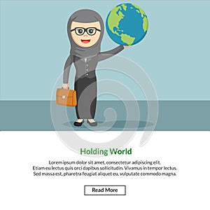 Hijabi enterpreneur holding a world photo