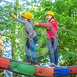 Hike and kids concept. Child boy having fun at adventure park. Climber child. Climber child on training. Kids boy