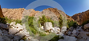 Hike through narrow valley of Wadi Shab in Tiwi near Mascat in Oman photo