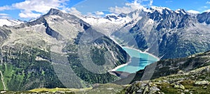A hike to the Olperer hut with views of Alpine lake Schlegeis in the valley Zillertal, Austrian Alps photo