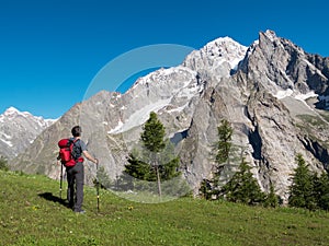 Hiker admiring mountain landscape around Mont Blan