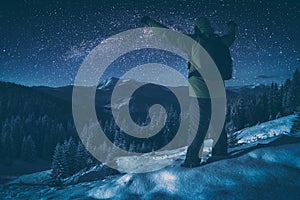 Hiker against starry night sky. Instagram stylisation