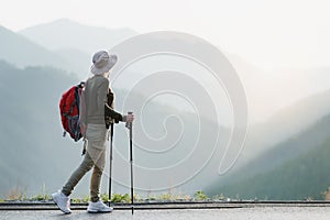 Hiker Alone Looking at View From Mountain Top