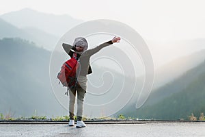 Hiker Alone Looking at View From Mountain Top