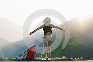 Hiker Alone Looking at View From Mountain Top