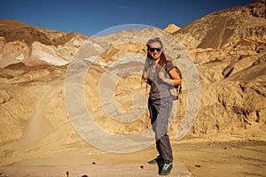 A hiker in the Artist`s Palette landmark place in Death Valley National Park, Geology, sand