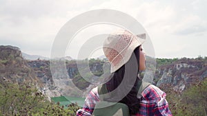 Hiker Asian backpacker woman walking to top of mountain, Female enjoy her holidays on hiking adventure feeling freedom. Lifestyle