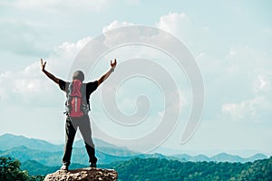 Hiker asian man happy feeling freedom good and strong weight victorious facing on the natural mountain