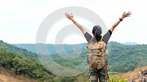 Hiker asian woman backpack raise hands happy feeling freedom good