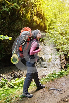 Hiker with backpack going to the mountain