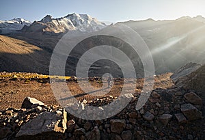 Hiker with backpack in the mountains