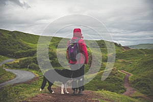 Hiker and Border Collie Exploring Fairy Glen on the Isle of Skye