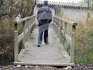Hiker on a bridge at lake ivars and vila sana, lerida, spain, europe