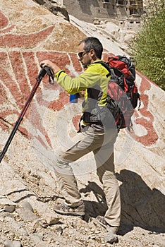 Hiker with buddhist wallpaints