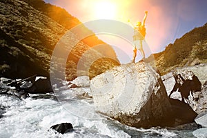 Hiker celebrating summer hike outdoors