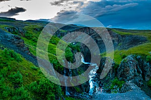 Hiker on a cliff edge in Skaftafell National Park, Iceland