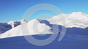 Hiker climbing mountain in winter season