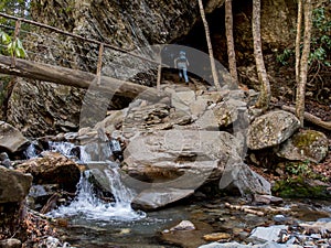 Hiker Climbs the Stairs Through Arch Rock