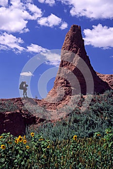 Hiker and collapsed watchtower photo