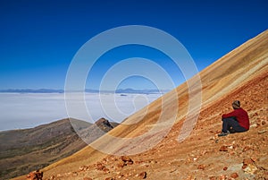 Hiker on colored mountain