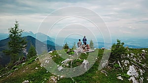 Petzen - Hiker couple on alpine meadow near Feistritzer Spitze (Hochpetzen) with panoramic view of majestic mountain peaks photo