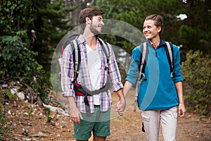 Hiker couple hiking in forest