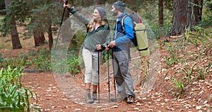 Hiker couple hiking in forest