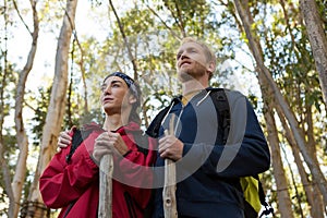 Hiker couple standing in forest