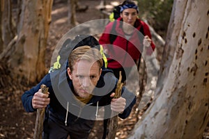 Hiker couple treading in forest