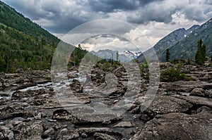 Hiker cross the mountain river