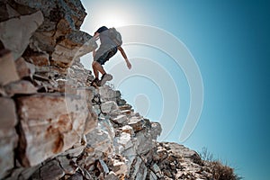 Hiker crossing rocky terrain