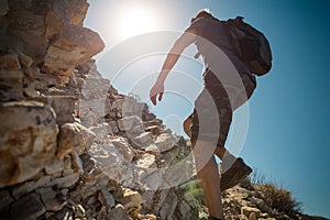 Hiker crossing rocky terrain