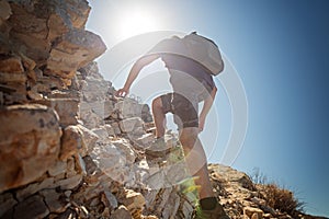 Hiker crossing rocky terrain