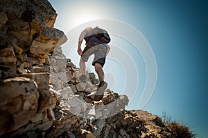 Hiker crossing rocky terrain