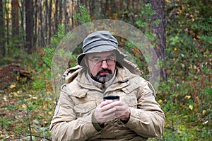 Hiker drink hot tea photo