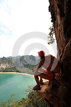hiker enjoy the view on mountain top cliff