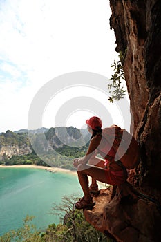 Hiker enjoy the view at sunrise mountain peak cliff