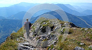 Hiker enjoys the beautiful landscape in the austrian alps / Otscher / Oetscher Peak in Lower Austria