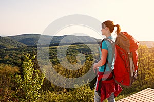 Hiker female standing up and looking panorama