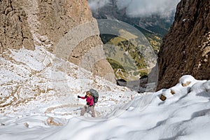 Hiker on footpath Sella Ronda mountain south Tyrol