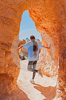 Hiker girl in Bryce Canyon hiking relaxing looking at amazing view during hike on summer travel in Bryce Canyon National