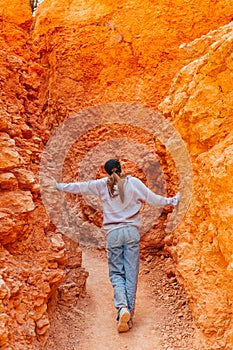 Hiker girl in Bryce Canyon hiking relaxing looking at amazing view during hike on summer travel in Bryce Canyon National