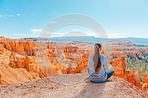 Hiker girl in Bryce Canyon hiking relaxing looking at amazing view during hike on summer travel in Bryce Canyon National