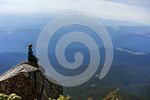 Hiker girl in the mountains, freedom concept, meditation, yoga